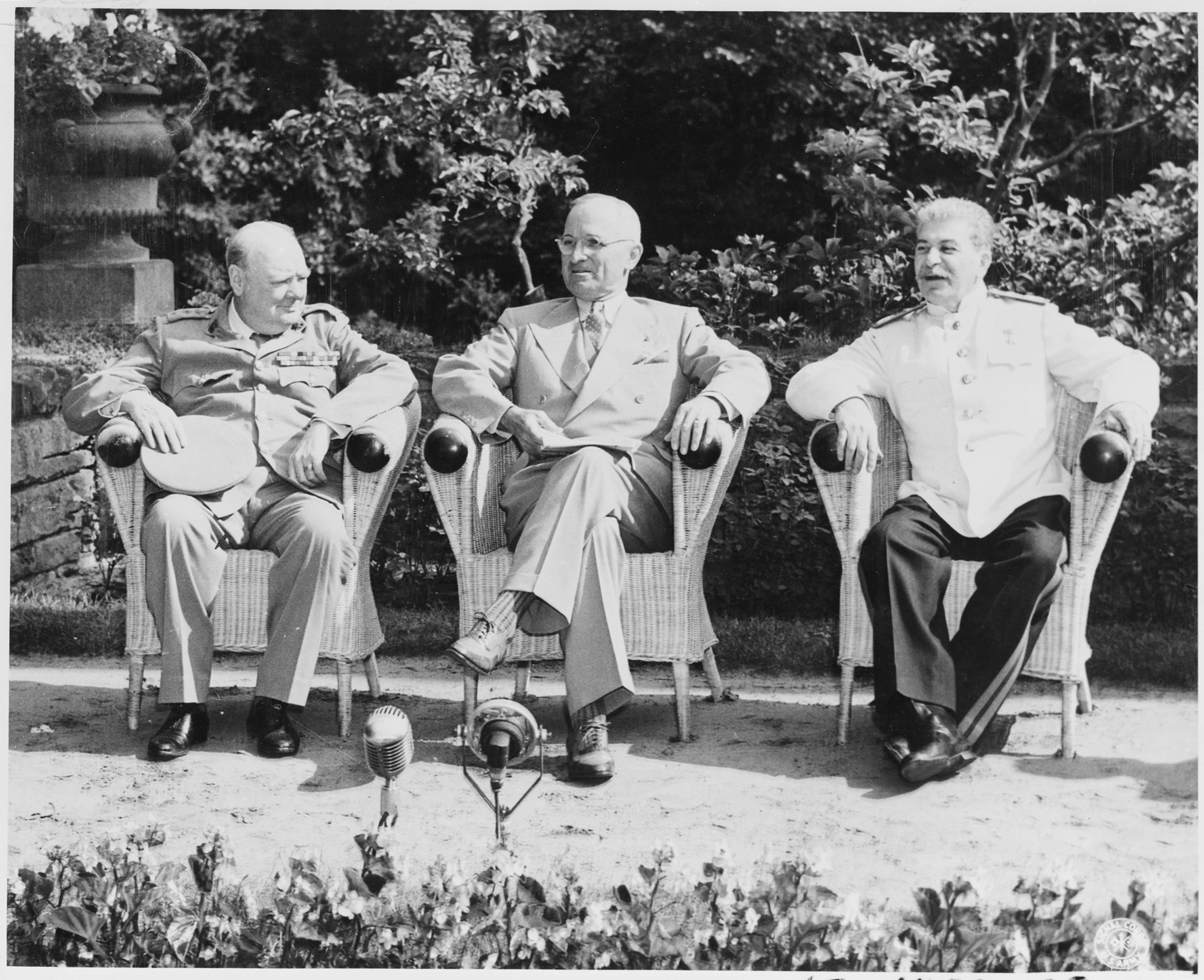 Churchill, Truman, and Stalin seated outdoors at Potsdam, 1945